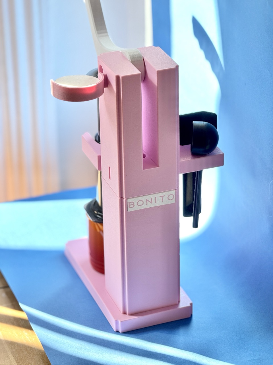 Pink Levermatic made for Bonito Coffee Roasters, photographed on a blue background
